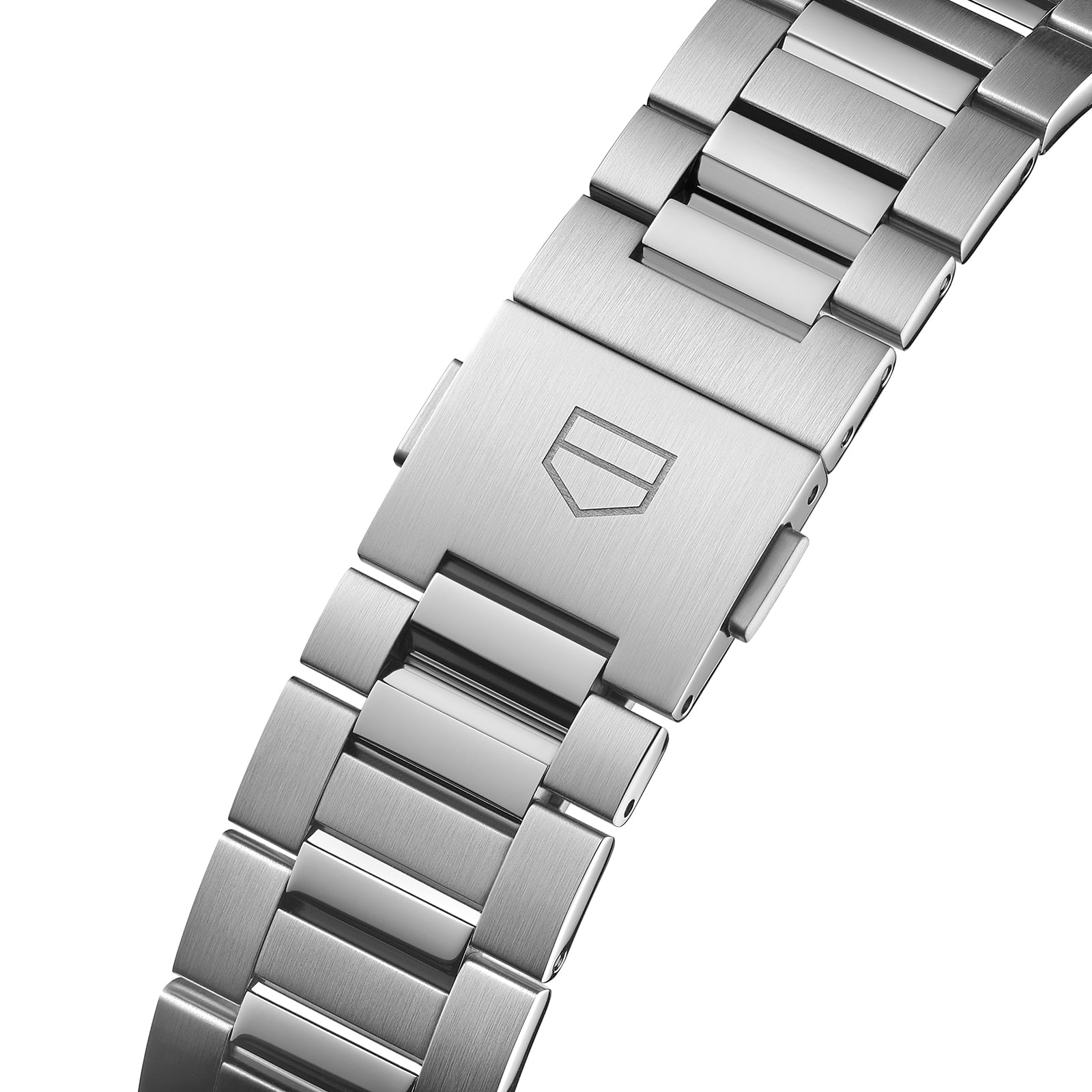 Close-up of a stainless steel TAG Heuer Carrera Day-Date bracelet with a secure clasp and engraved shield logo, paired with a blue sunray dial and calibre 5 automatic movement.