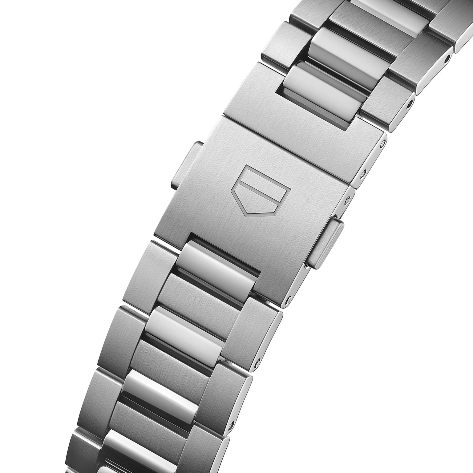 Close-up of the TAG Heuer Carrera Date’s stainless steel bracelet, highlighting its brushed clasp engraved with the iconic shield logo.
