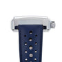 Side view of the TAG Heuer Special Edition Monaco Gulf, featuring a silver rectangular case, blue perforated leather strap, metal crown, and the precision of the automatic Heuer 02 movement.