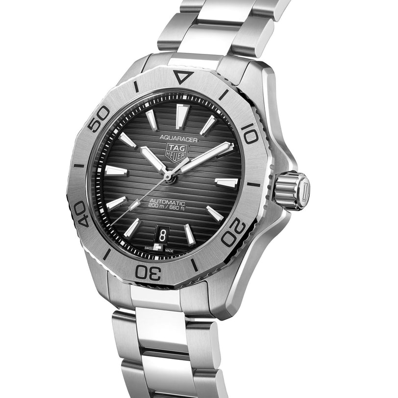 The TAG Heuer Aquaracer Professional 200 Date is a stainless steel wristwatch featuring a black dial, silver hour markers, and a rotating bezel.