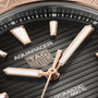 Close-up of a TAG Heuer Aquaracer Professional 200 watch face featuring gold hands and markers, showcasing detailed branding.