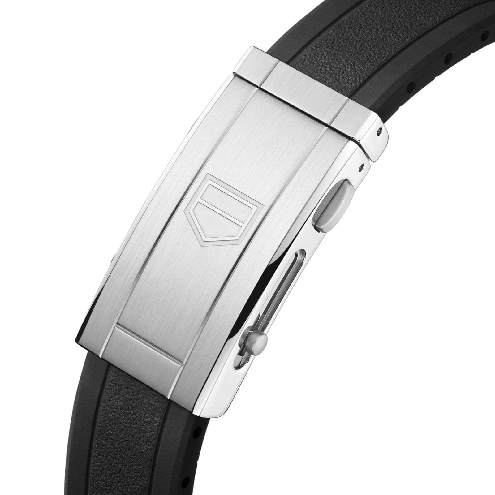 Close-up of the TAG Heuer Aquaracer Professional 200’s stainless steel clasp with geometric logo, attached to a textured black rubber strap—highlighting the refined details of this iconic sports watch.