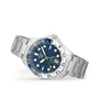 The TAG Heuer Aquaracer Professional 300 GMT sports watch features a silver stainless steel band, vibrant blue dial with white and yellow accents, date display, and GMT movement, displayed on a white background.