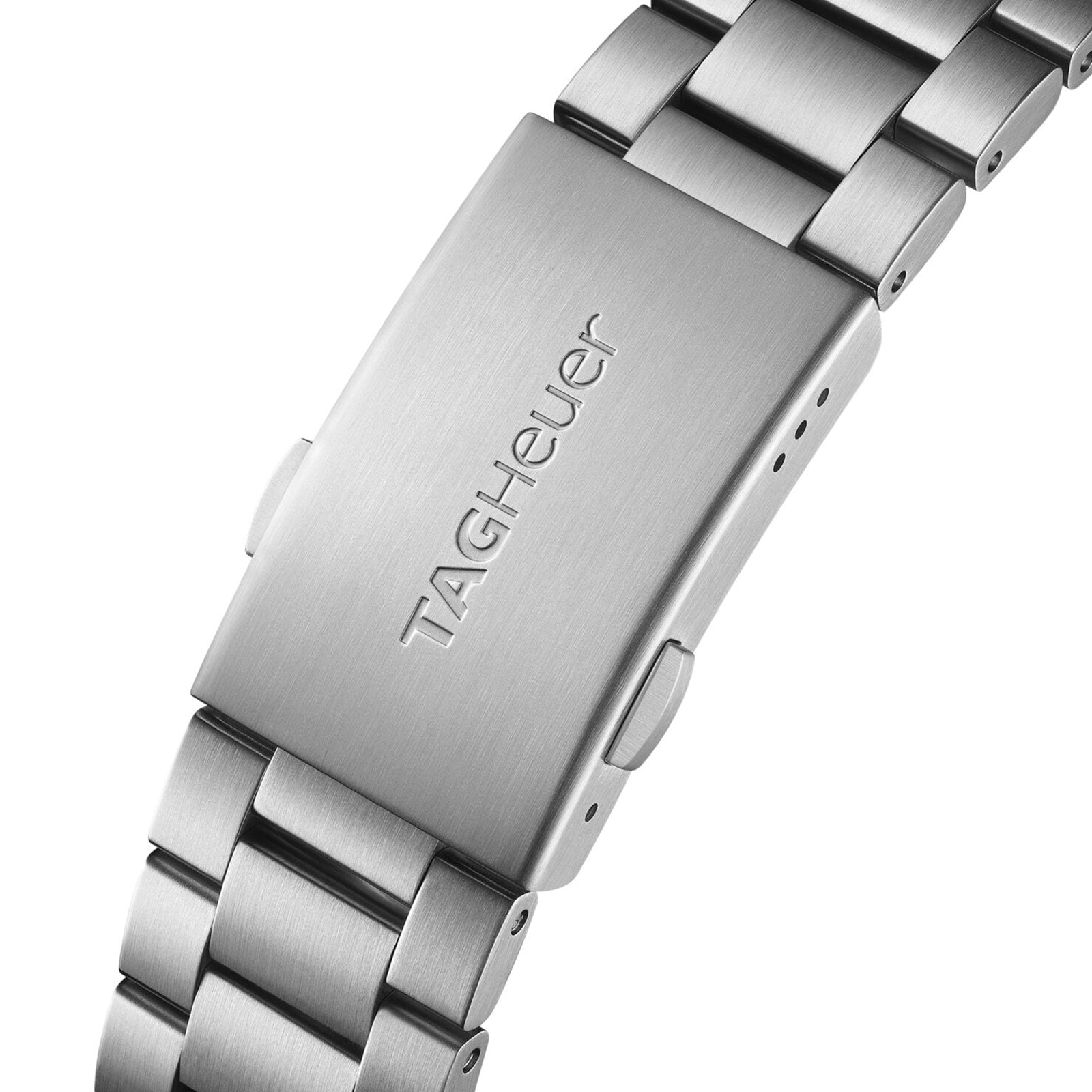 Close-up of a brushed stainless steel TAG Heuer Special Edition Formula 1 Chronograph X Gulf bracelet clasp, featuring the engraved TAG Heuer logo.