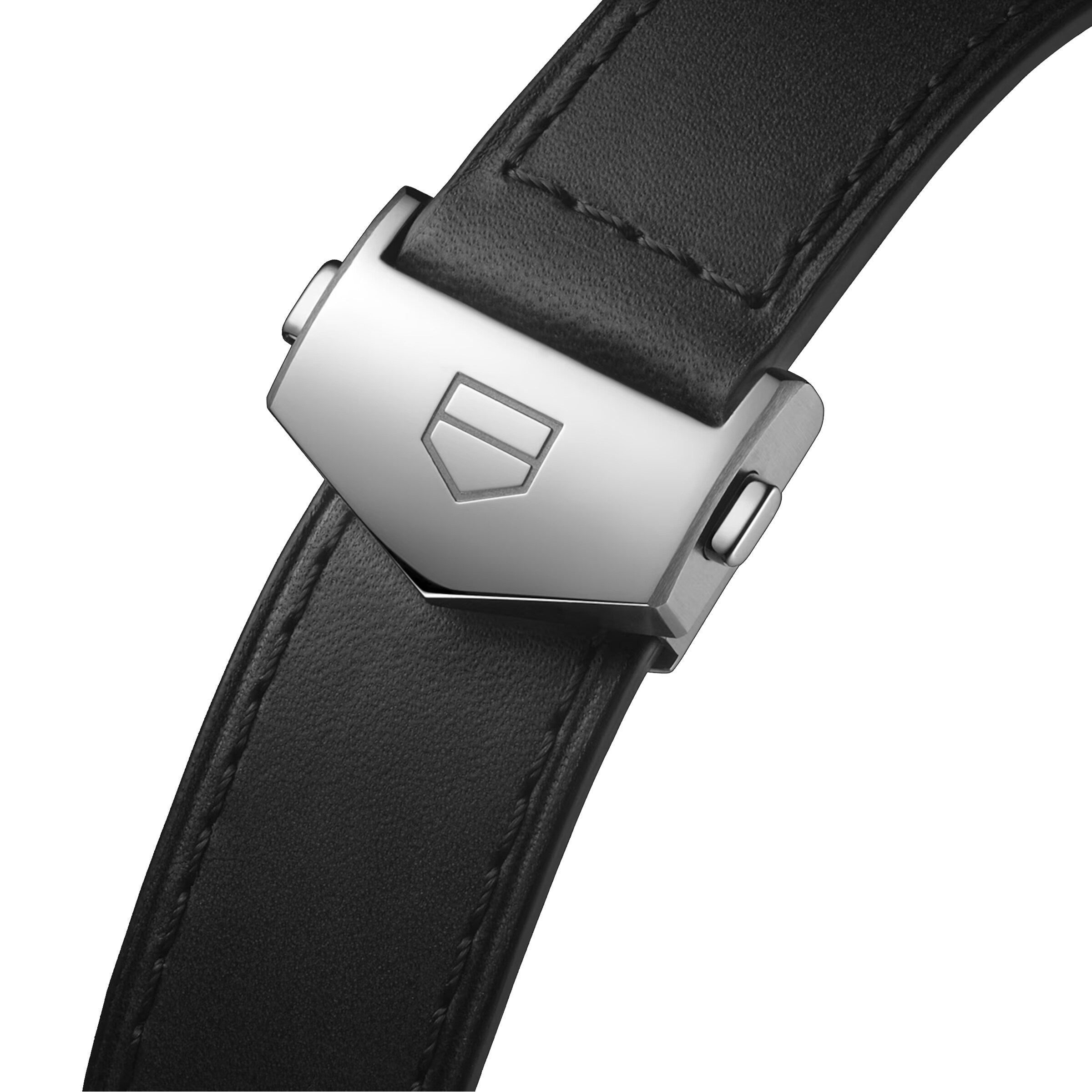 Close-up of a black leather strap with a silver stainless steel clasp featuring an embossed shield logo, perfectly complementing the black dial and Calibre HEUER 02 movement of the TAG Heuer Carrera Chronograph.