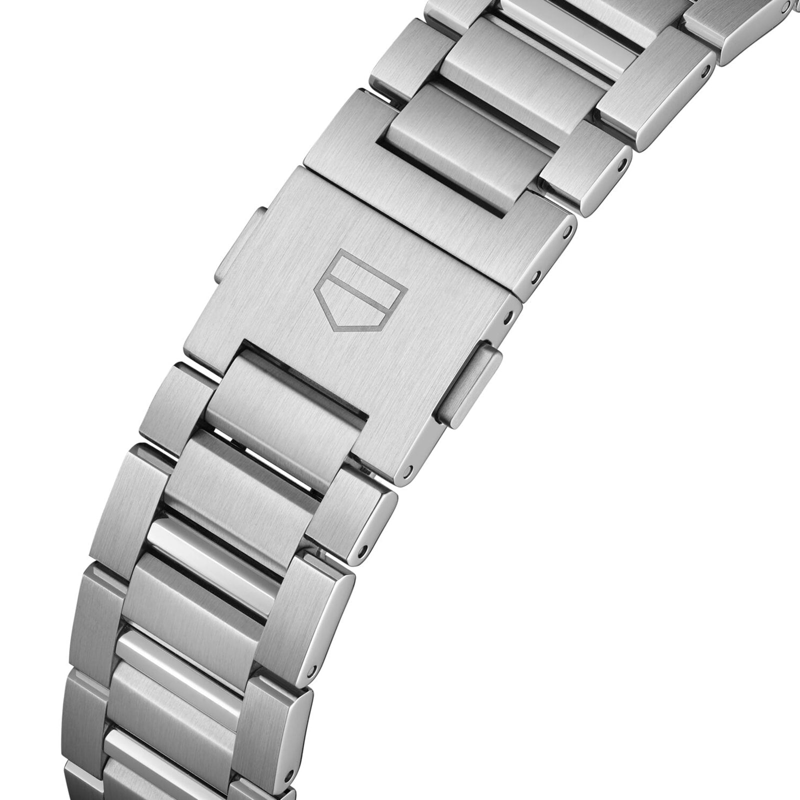 Close-up of the TAG Heuer Carrera Chronograph’s stainless steel bracelet with fold-over clasp, engraved with the shield logo—highlighting its motor-racing heritage.