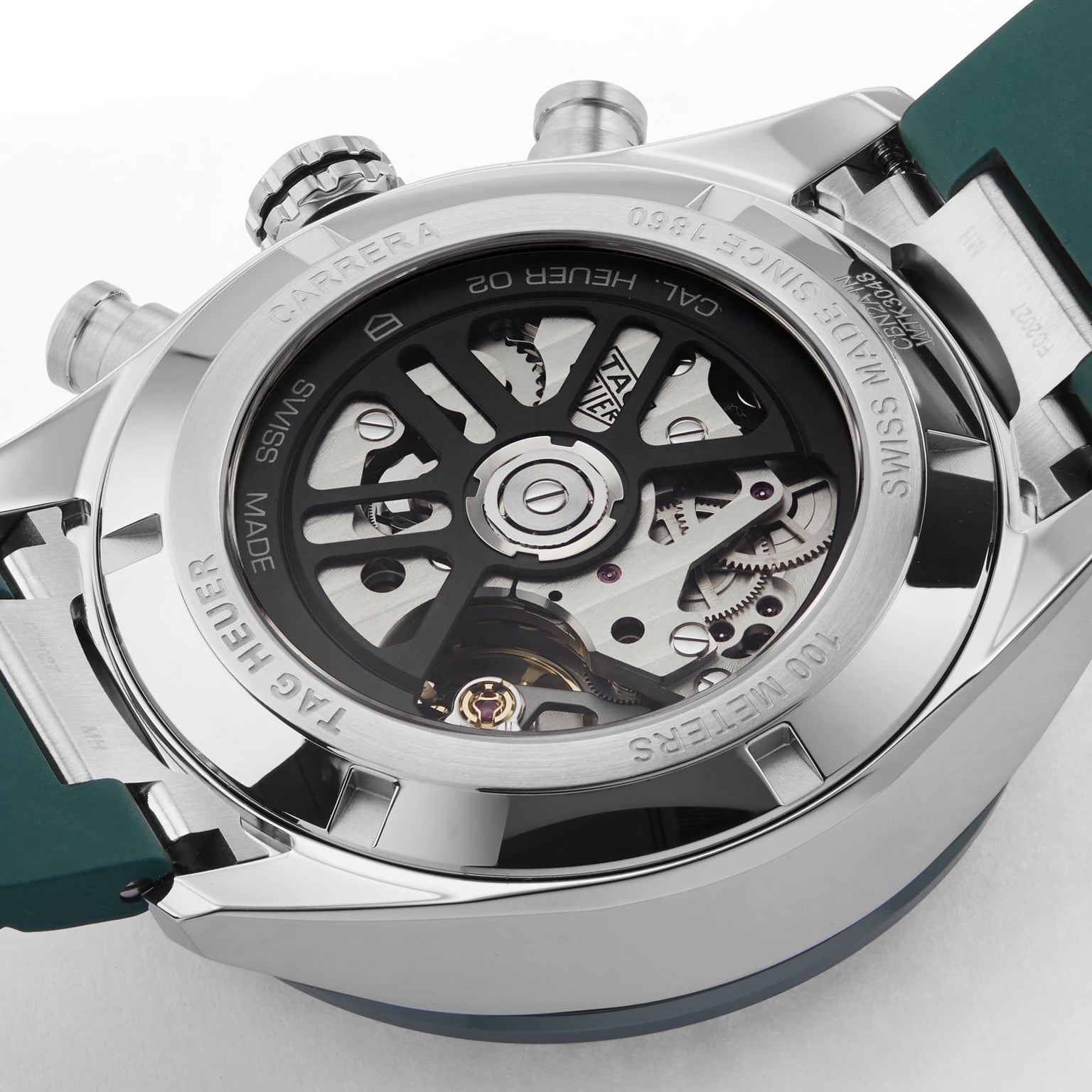 Close-up of the back of a TAG Heuer Carrera Chronograph watch, revealing its exposed automatic movement.