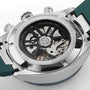 Close-up of the back of a TAG Heuer Carrera Chronograph watch, revealing its exposed automatic movement.