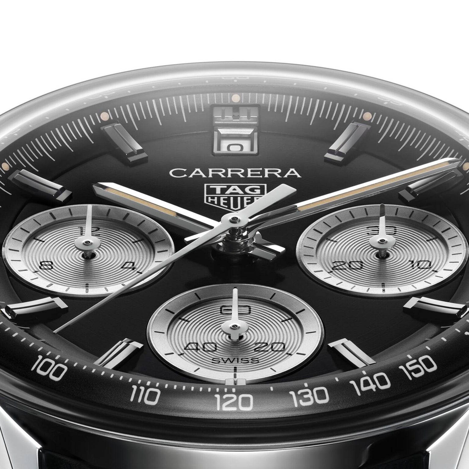 Close-up of a TAG Heuer Carrera Chronograph watch face with three subdials, silver markers, a black tachymeter bezel, and a sleek black leather strap.