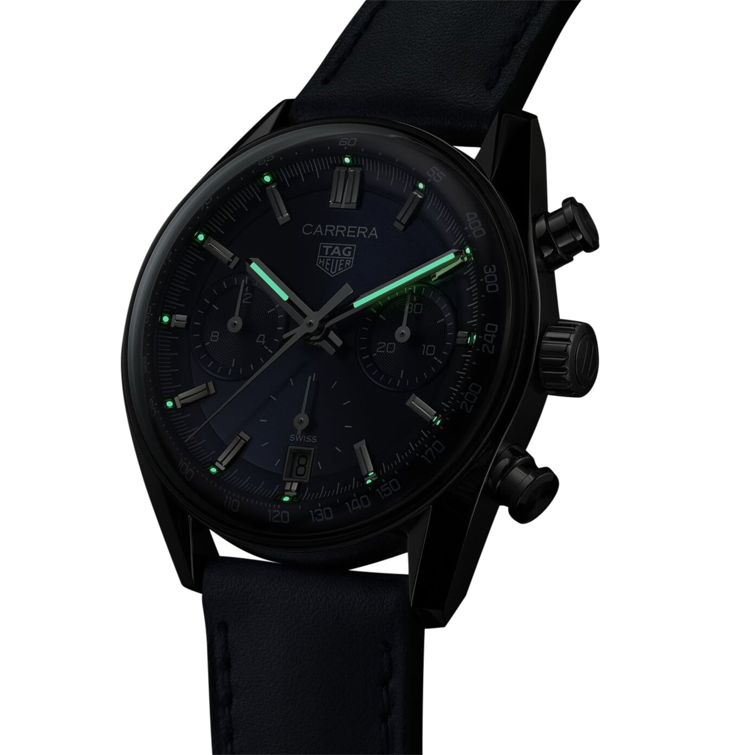 A TAG Heuer Carrera Chronograph watch with green luminescent hands and markers, black dial, black leather strap, and Calibre TH20-00 movement is displayed at an angle on a white background.