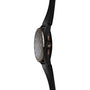 Side view of the TAG Heuer Limited Edition Connected Calibre E4 Bright Black Edition—luxury performance watch with a black round face, gold accents, and black leather strap—displayed against a white background.
