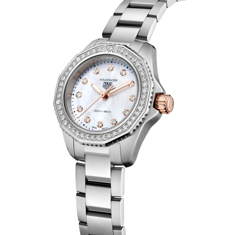 The TAG Heuer Aquaracer Professional 200 is a stainless steel wristwatch with a diamond-set bezel, white mother-of-pearl dial, rose gold accents, and a silver metal bracelet.