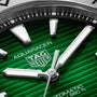 Close-up of a TAG Heuer Aquaracer Professional 200 sports watch featuring a green textured dial, silver hands and markers, partial logo, water resistance text, all within a sleek stainless steel case.