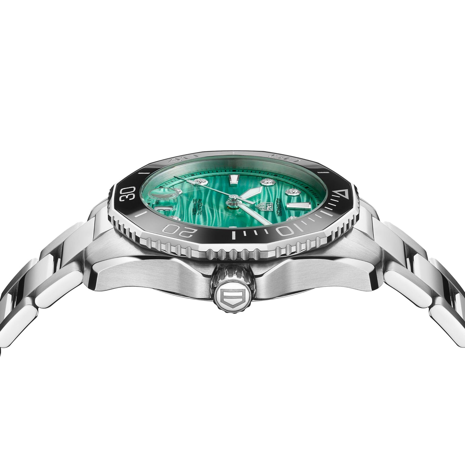 A side view of the TAG Heuer Aquaracer Professional 300 Date sports watch shows its silver metal band, black bezel, and green patterned dial with hour, minute, and second hands.