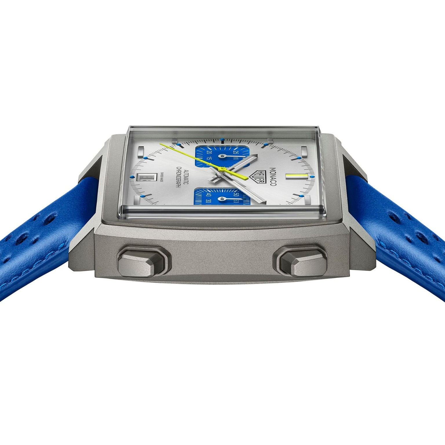 A square TAG Heuer Limited Edition Monaco Chronograph French Racing Blue wristwatch with silver case, blue accents, two push buttons, and a blue leather strap, viewed from a low angle.