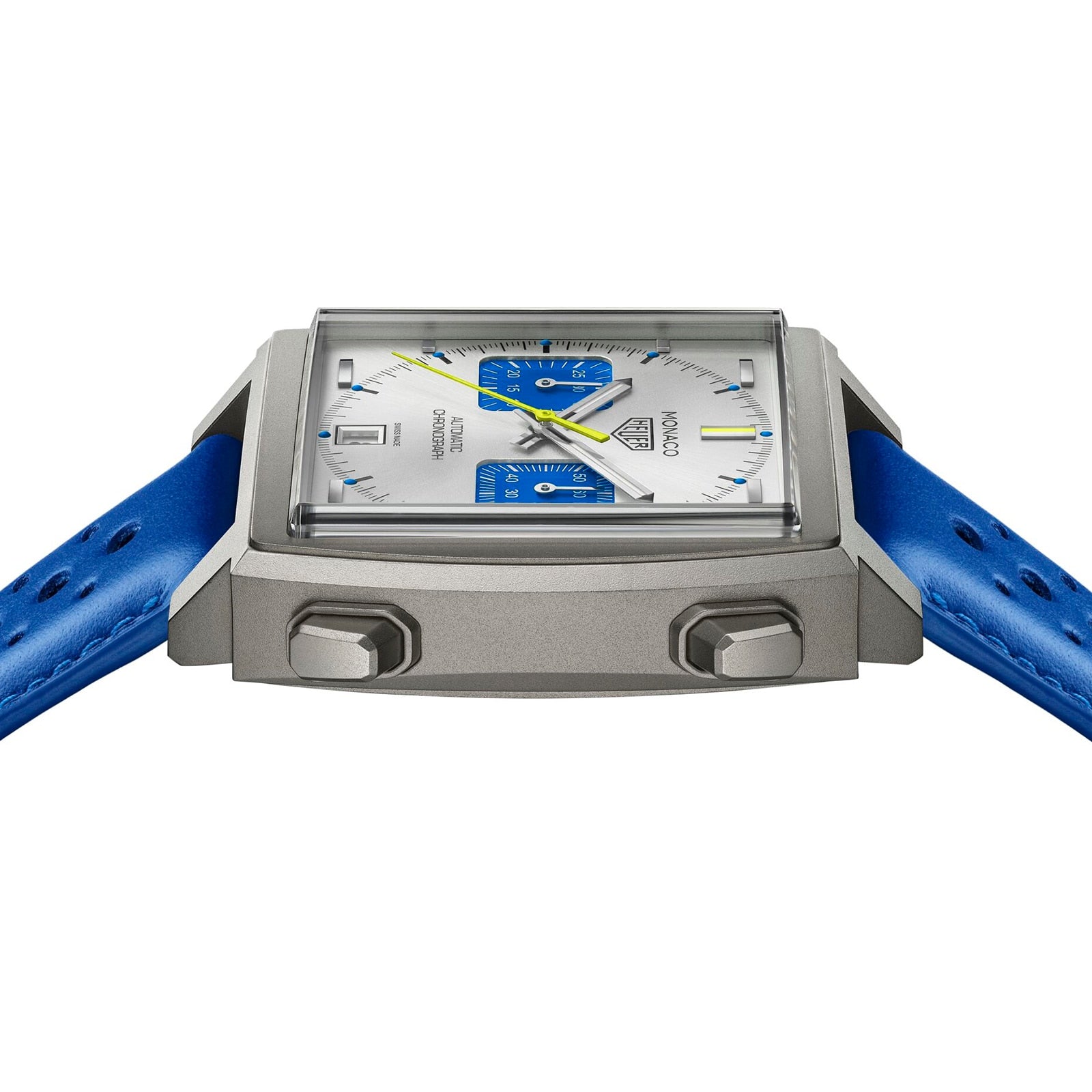 A square TAG Heuer Limited Edition Monaco Chronograph French Racing Blue wristwatch with silver case, blue accents, two push buttons, and a blue leather strap, viewed from a low angle.