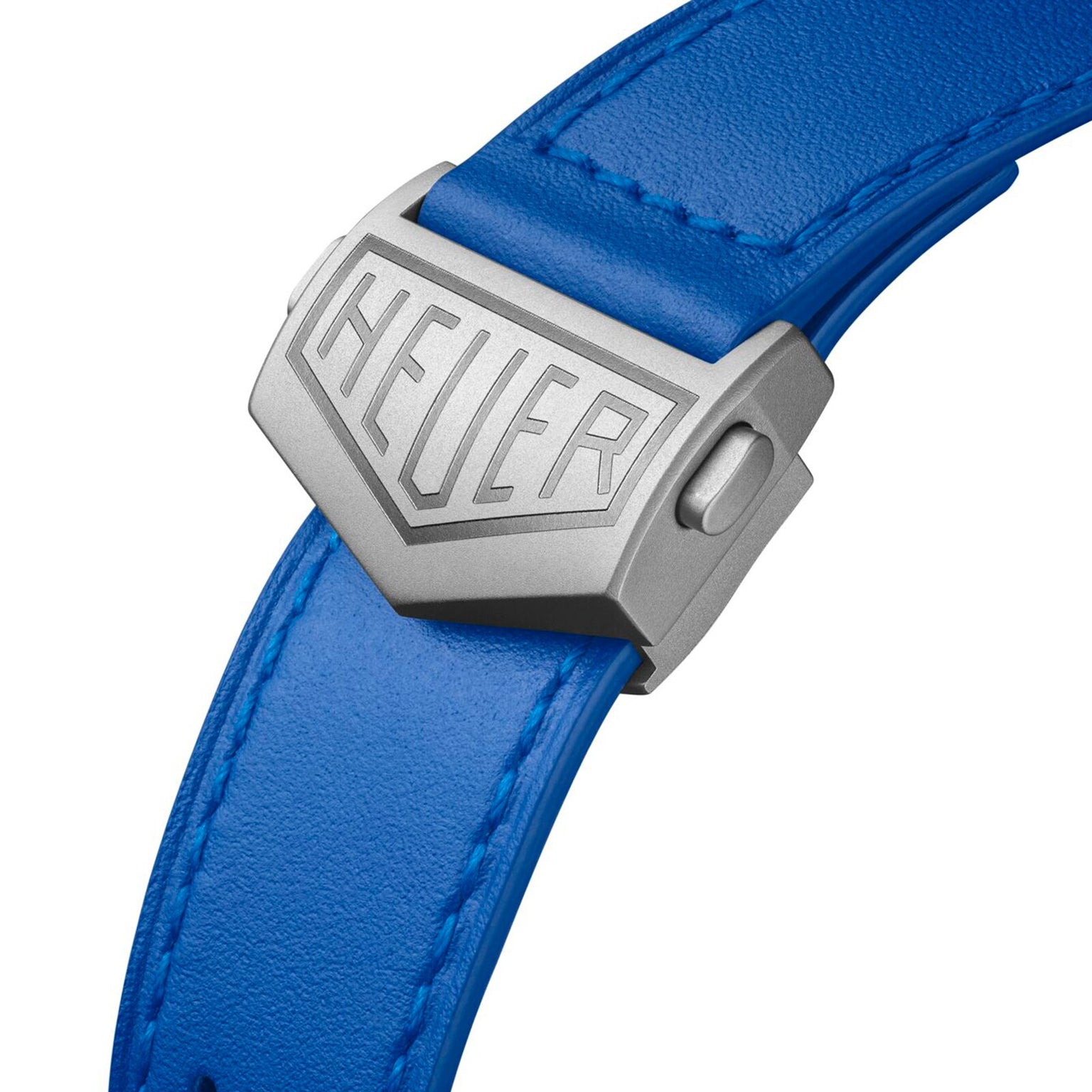 Close-up of a blue leather strap with a HEUER-engraved clasp on the TAG Heuer Limited Edition Monaco Chronograph French Racing Blue, inspired by the iconic Monaco and its legendary Calibre 11 movement.