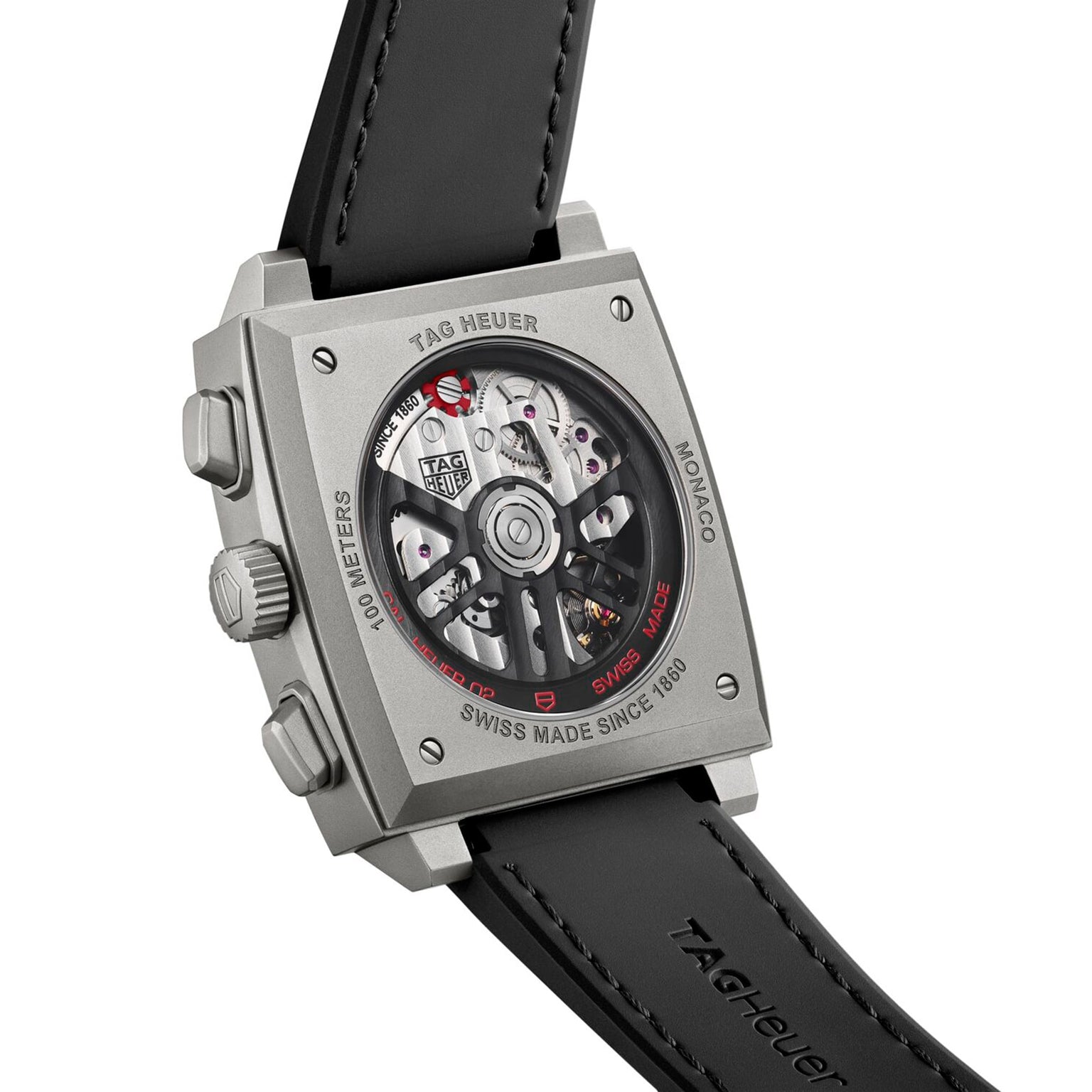 Back view of the TAG Heuer Monaco Chronograph showing its automatic movement through a transparent caseback, paired with a black leather strap and detailed with engraved branding.