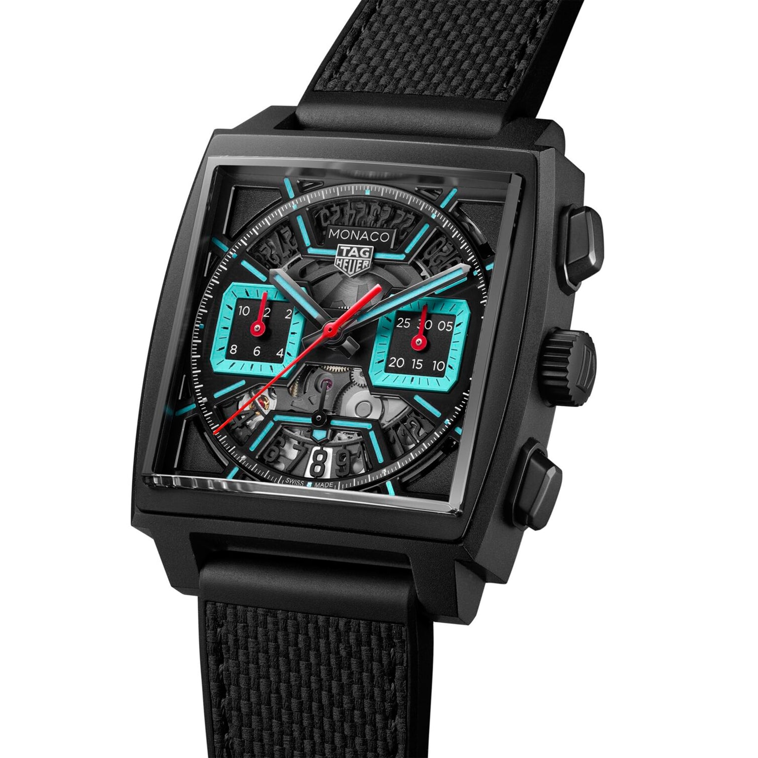 The TAG Heuer Monaco Chronograph features a black titanium case, black strap, and turquoise-red accented chronograph dials with calibre Heuer 02.