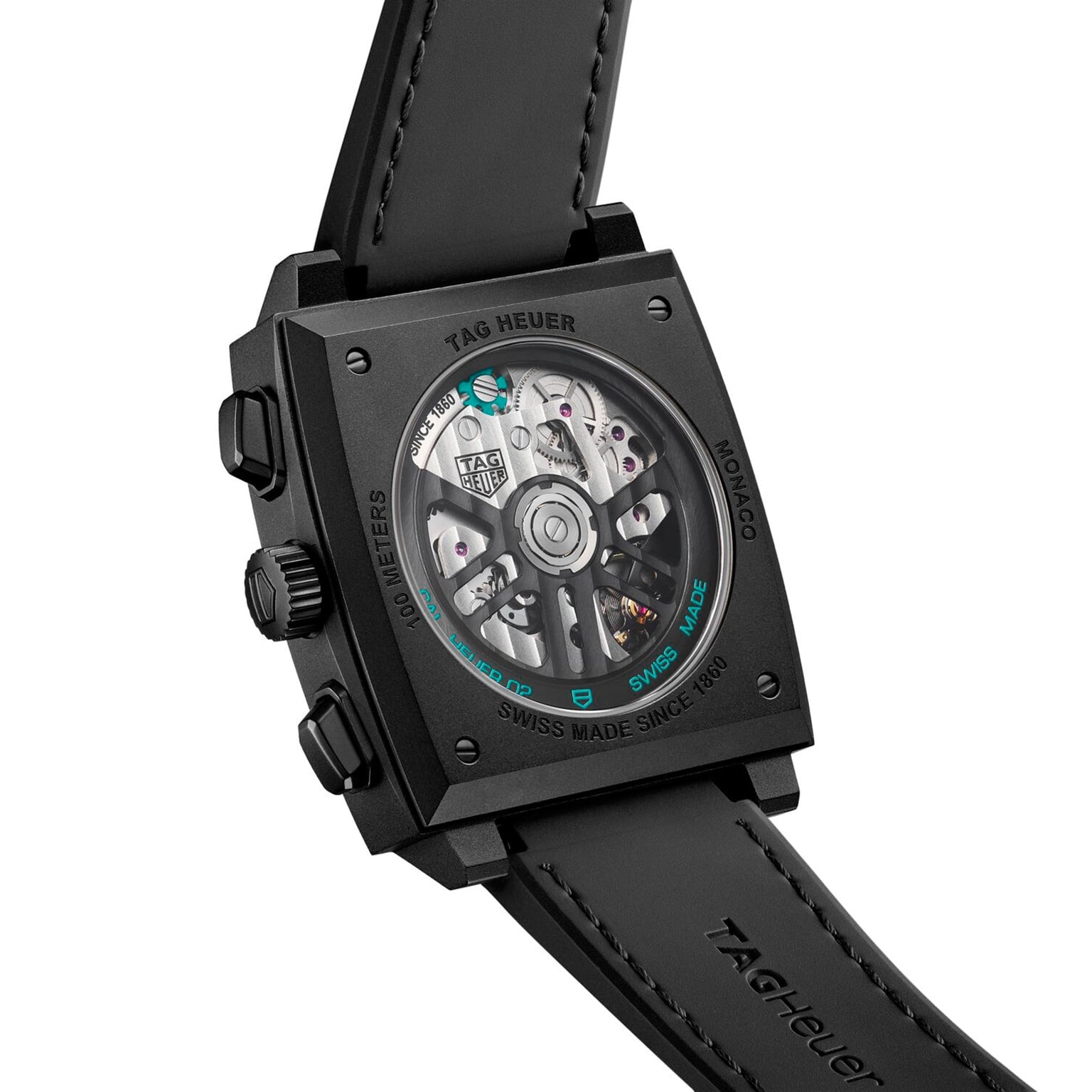 Back view of TAG Heuer Monaco Chronograph showing its exposed mechanical movement and black leather strap.