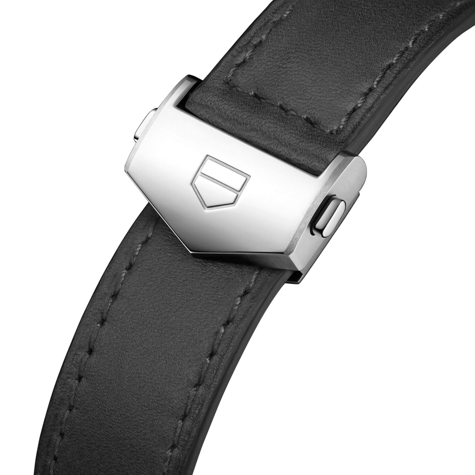 Close-up of the TAG Heuer Special Edition Carrera Chronosprint x Porsche’s black leather strap with a silver clasp engraved with a geometric logo.