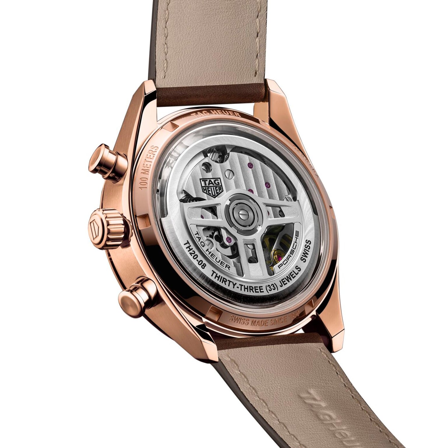 A close-up of the TAG Heuer Special Edition Carrera Chronosprint x Porsche showcases its transparent case, automatic chronograph movement, and brown leather strap—a design inspired by the spirit of the Porsche 911.