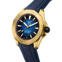 The TAG Heuer Aquaracer Professional 200 Date is a yellow gold-tone watch with a blue striped dial, TH31-00 calibre, and blue rubber strap, shown at 10:10.