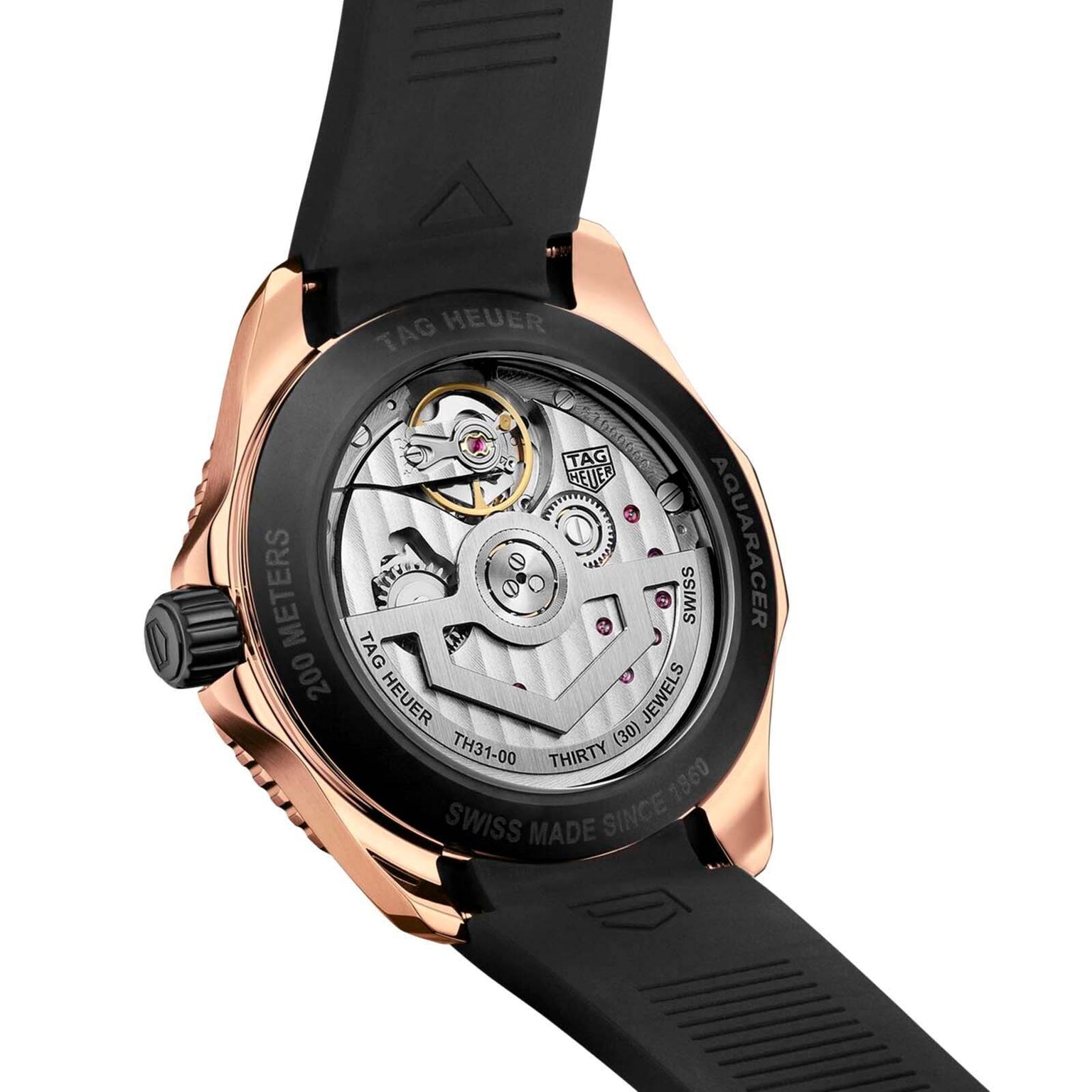 Close-up of the back of a TAG Heuer Aquaracer Professional 200 watch, showing the transparent case with TH31-00 calibre movement and rose gold engraved rim details.