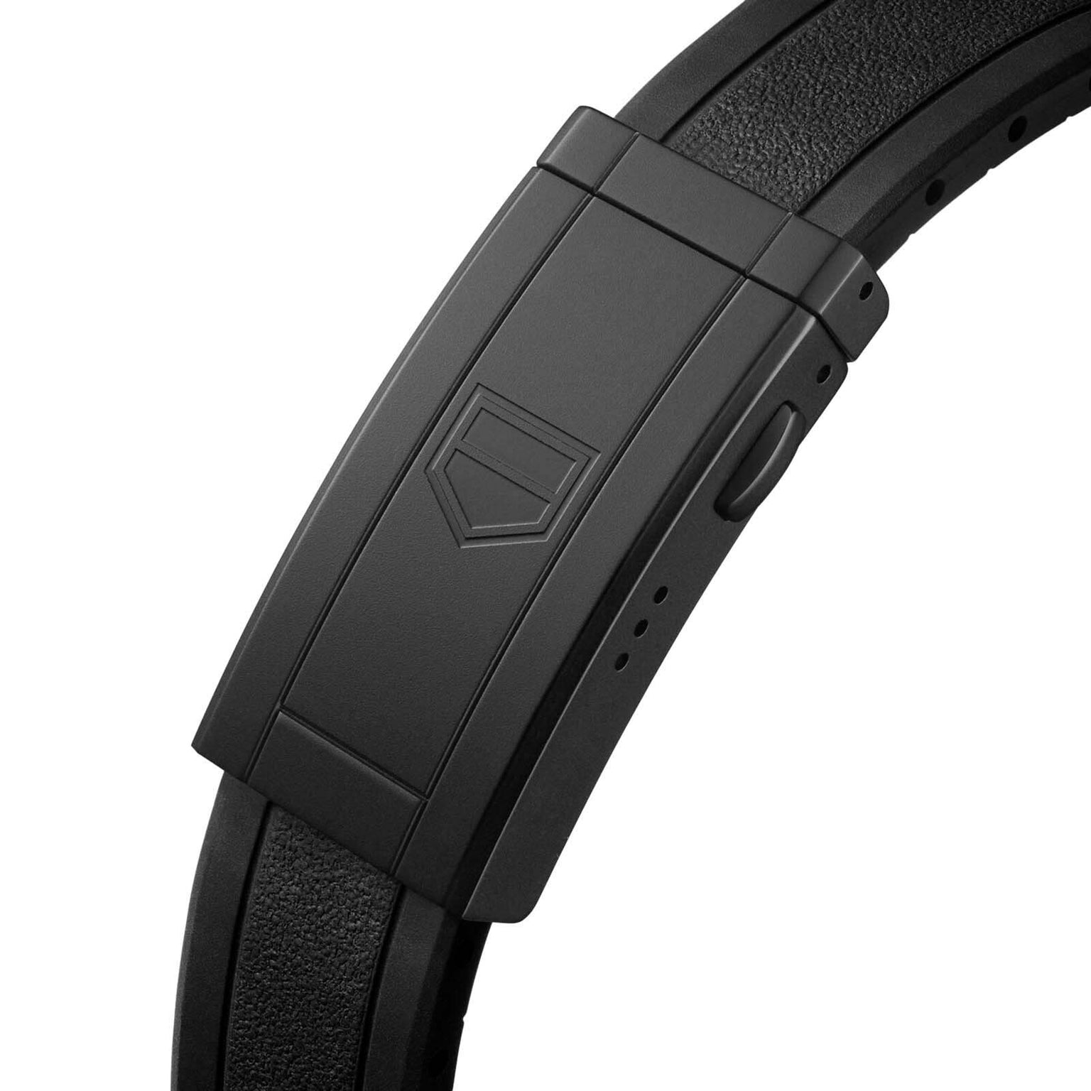 Close-up of a black clasp with a geometric logo on a textured leather strap, showcasing an elegant detail from the TAG Heuer Aquaracer Professional 200.
