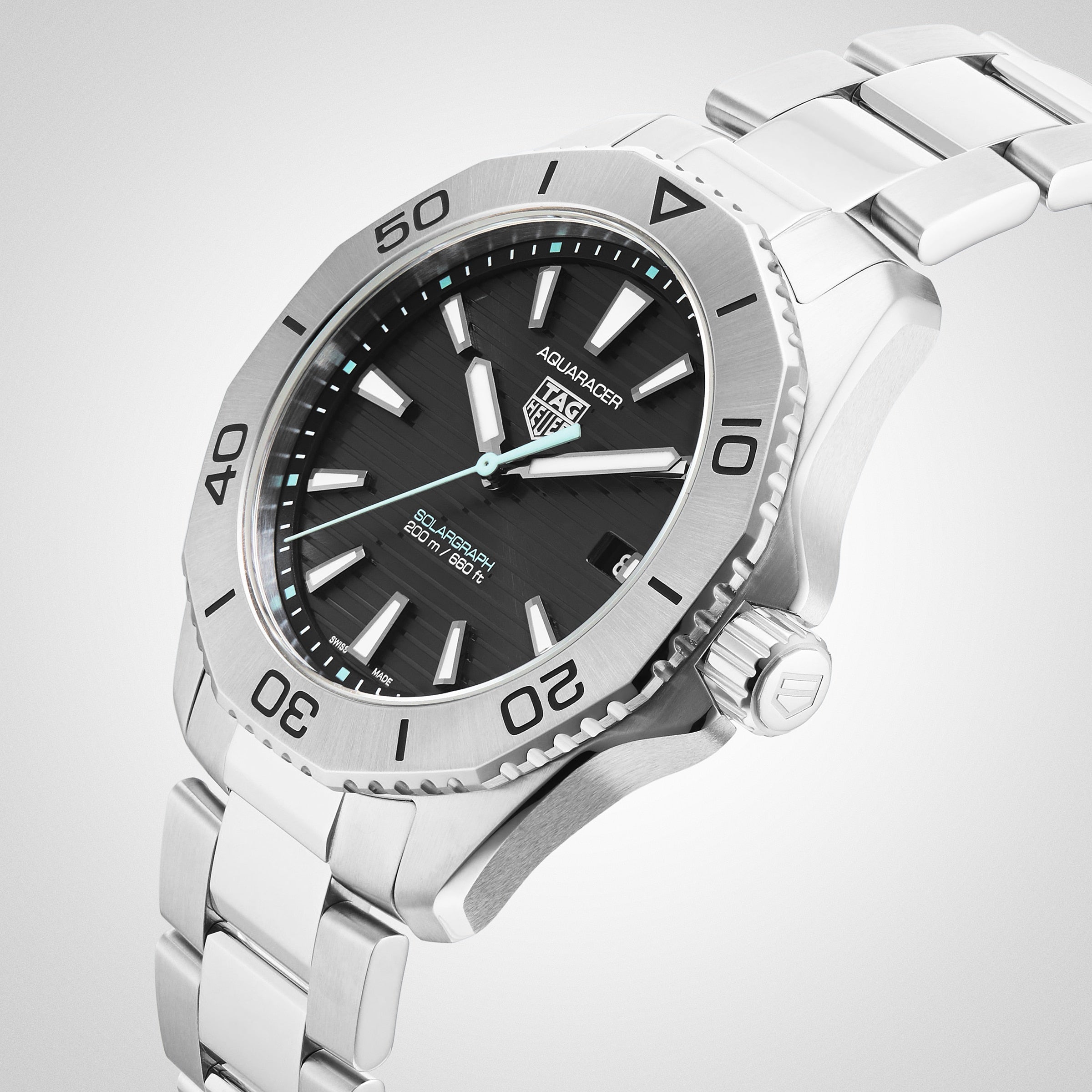 The TAG Heuer Aquaracer 200 Professional Solargraph features a stainless steel case, black dial, bold hour markers, rotating bezel, and metal bracelet displayed on a light background.