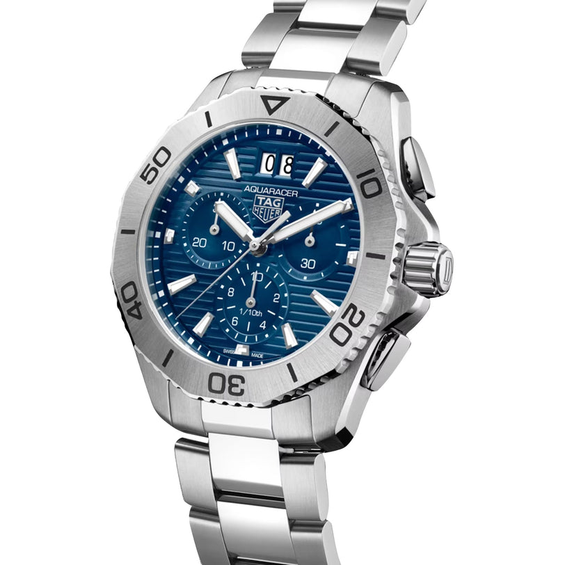 A TAG Heuer Aquaracer 200 Professional Solargraph wristwatch with a silver case, blue dial, and metal bracelet is displayed at an angle on a white background—an eye-catching example of luxury timepieces.