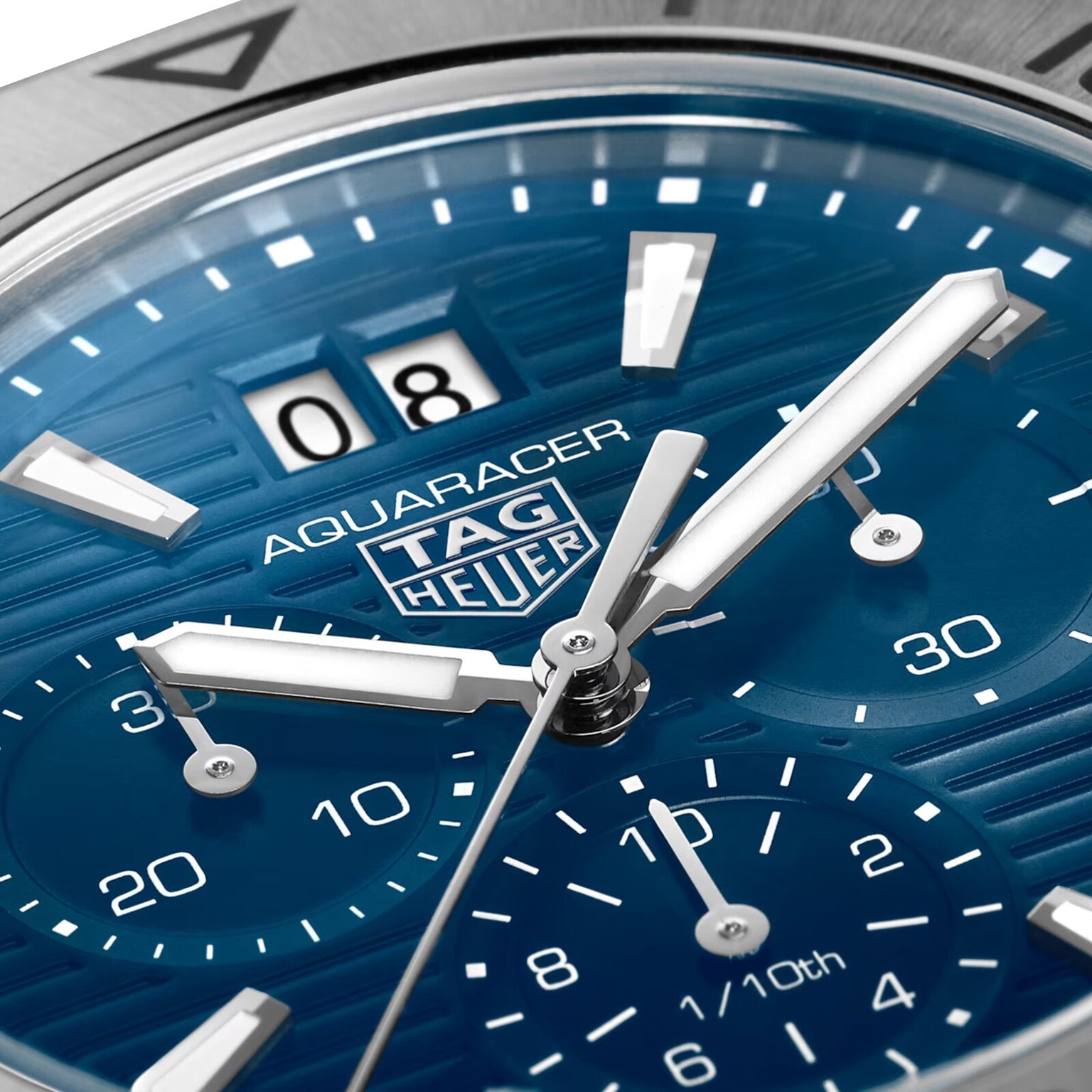 Close-up of a blue TAG Heuer Aquaracer 200 Professional Solargraph watch face showcasing its hands, subdials, and date display.