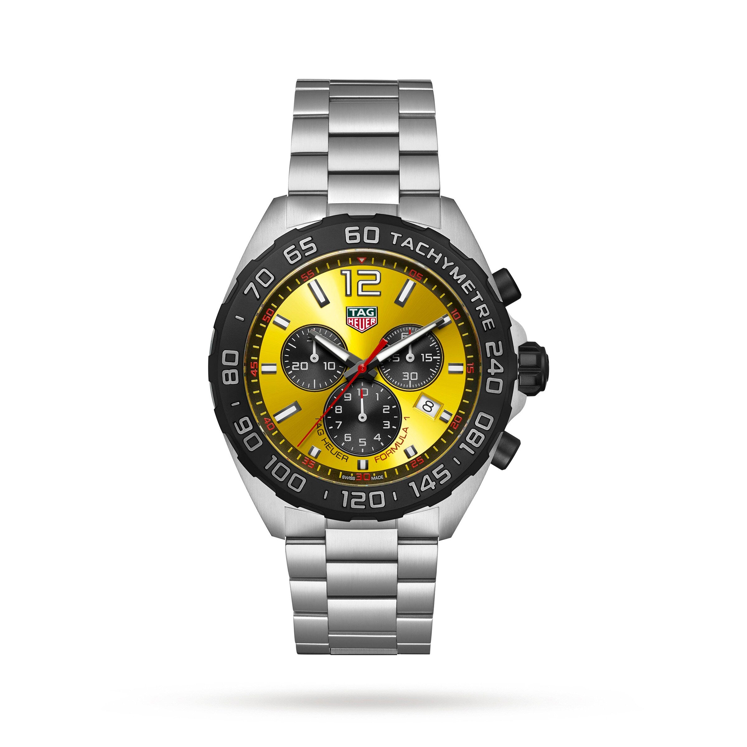 The TAG Heuer Formula 1 Chronograph features a stainless steel case, yellow and black tachymeter dial with three subdials, metal bracelet, and motor racing-inspired design, displayed on a white background.