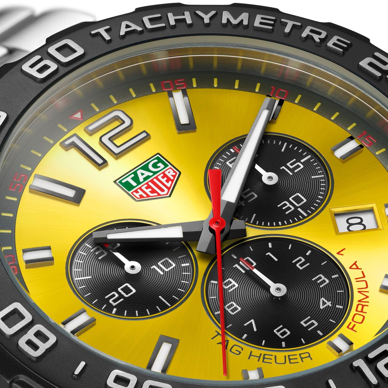 Close-up of the TAG Heuer Formula 1 Chronograph, inspired by motor racing, with a yellow dial, three subdials, date display, and tachymeter bezel.