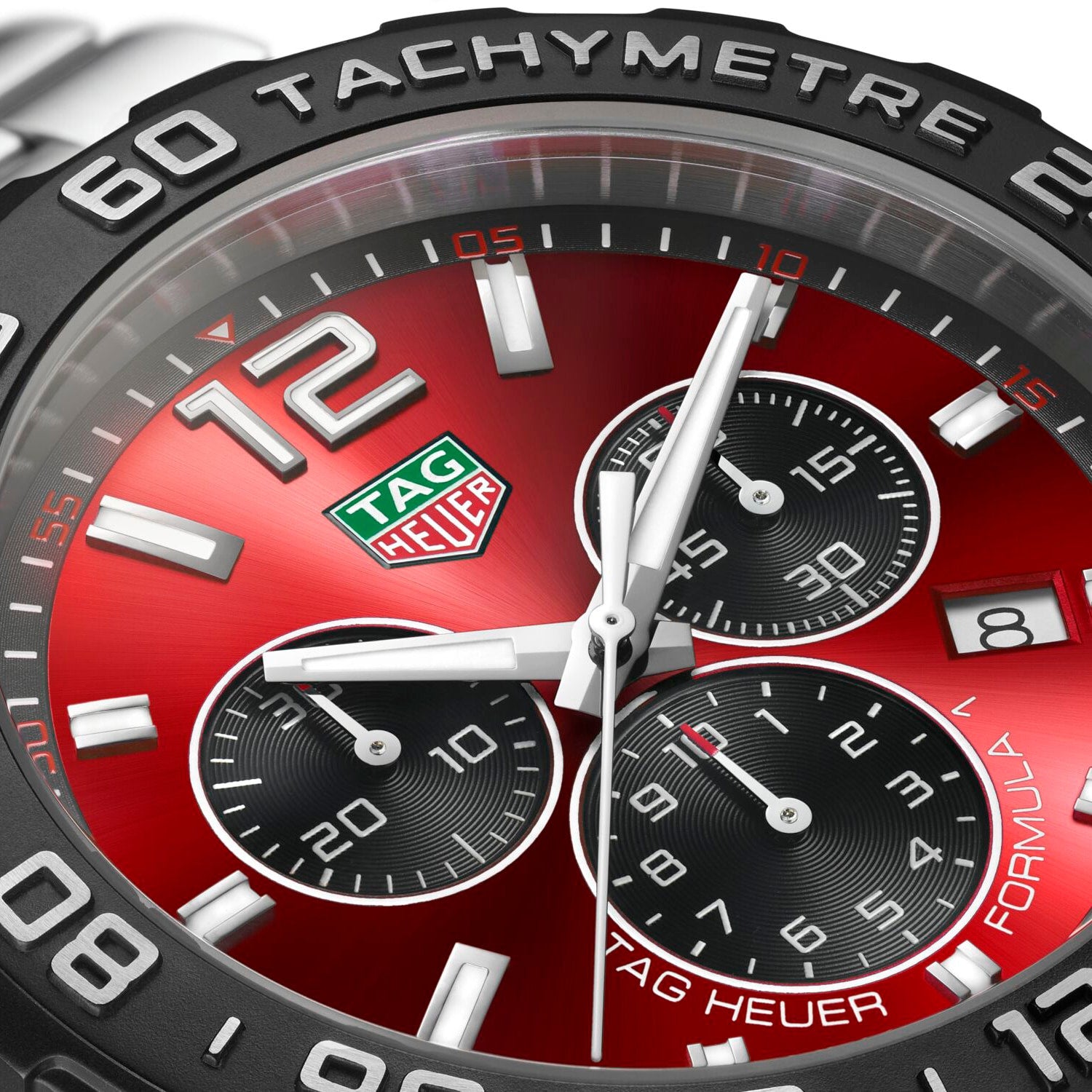 Close-up of the TAG Heuer Formula 1 Chronograph featuring a red dial, three black subdials, white hands, date display at 4 o’clock, and a tachymeter scale—a standout luxury chronograph from TAG Heuer.