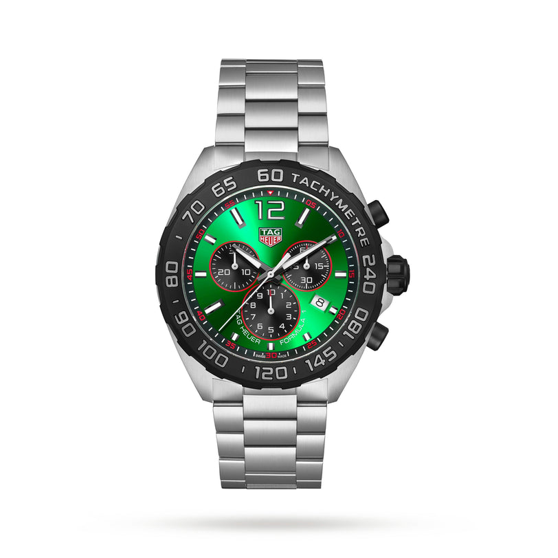 The TAG Heuer Formula 1 Chronograph features a stainless steel case, green and black dial with three subdials, a tachymeter bezel, and silver link bracelet—an iconic luxury watch—displayed on a white background.