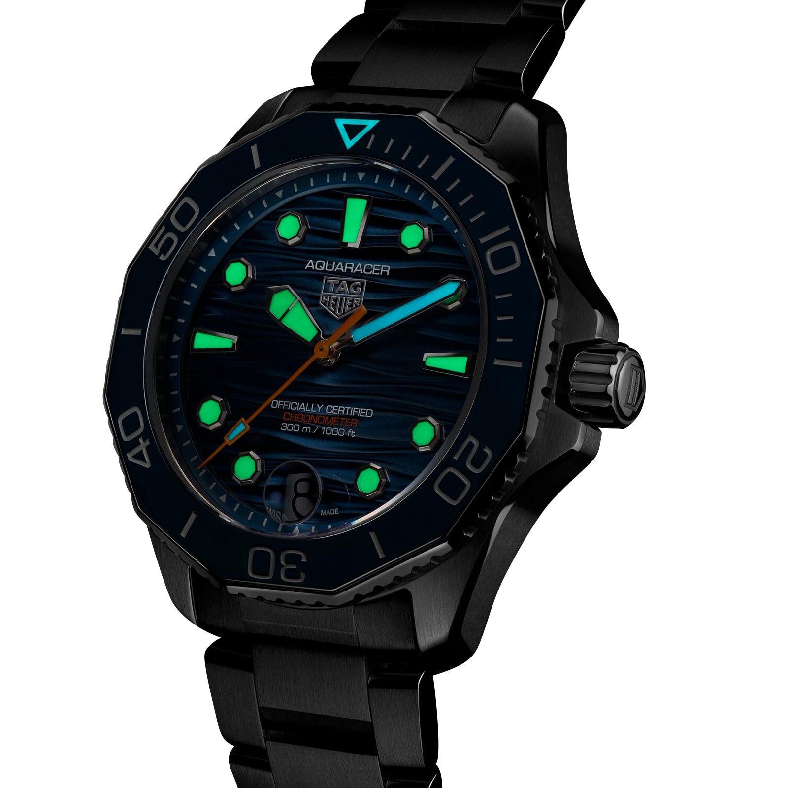The TAG Heuer Aquaracer Professional 300 Date wristwatch features a dark metal band and dial with luminous green hands and markers, exemplifying Swiss watchmaking precision.