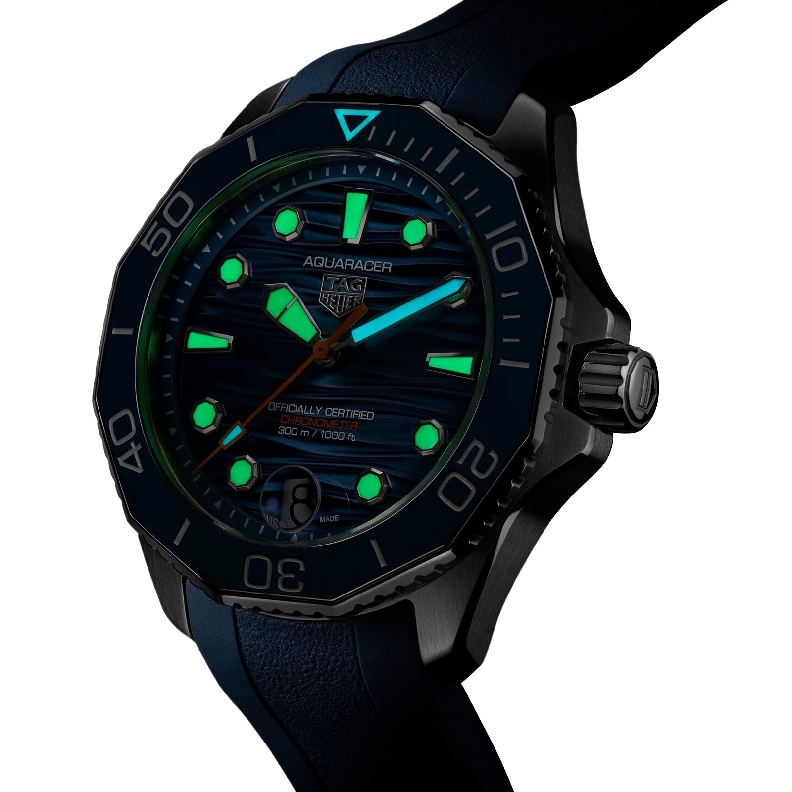 Close-up of the TAG Heuer Aquaracer Professional 300 Date, featuring illuminated markers and hands on its dark dial with a textured bezel—precision-crafted for excellence in deep-sea exploration.