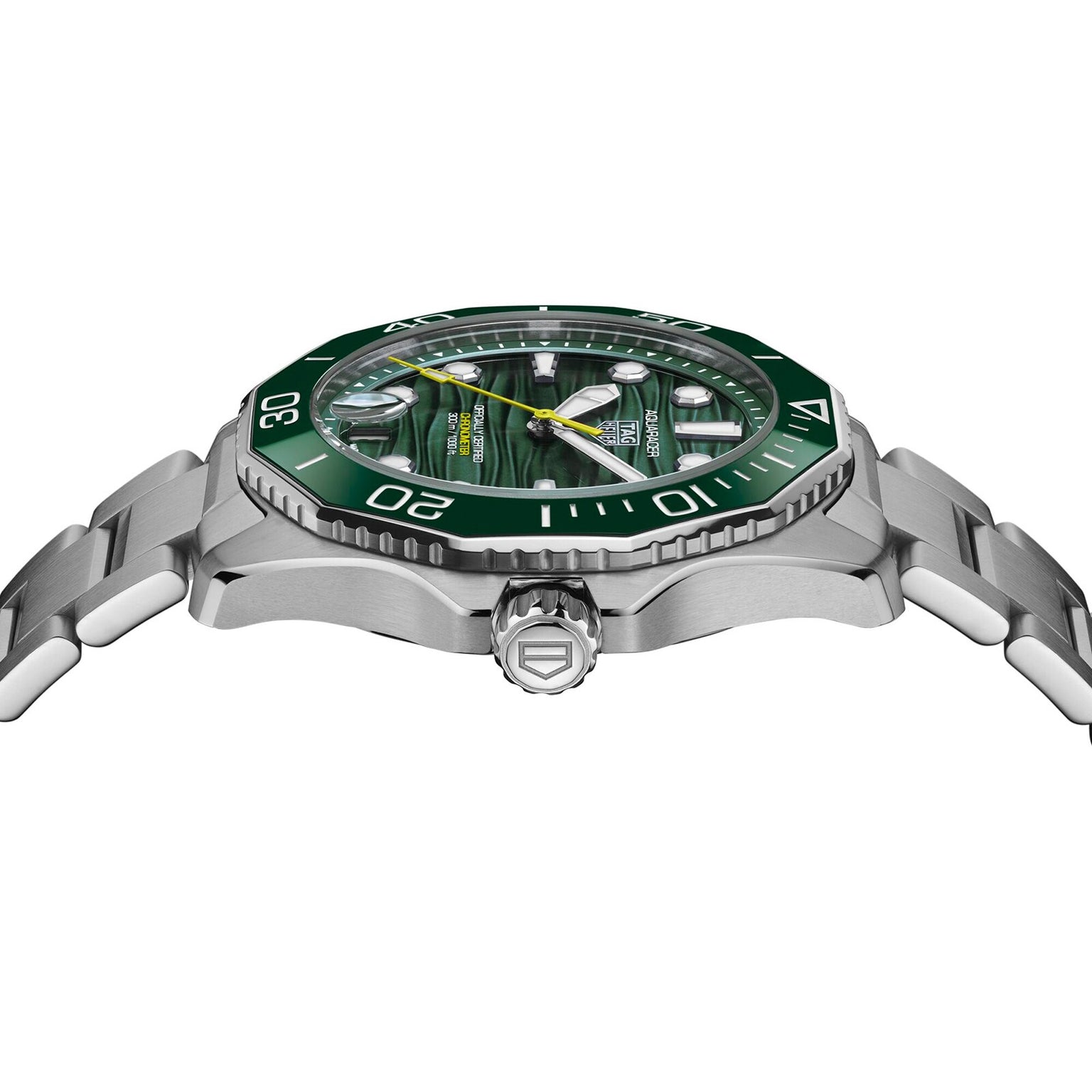 A TAG Heuer Aquaracer Professional 300 Date wristwatch with a green ceramic bezel and dial, shown from the side to highlight its stainless steel bracelet and engraved crown.
