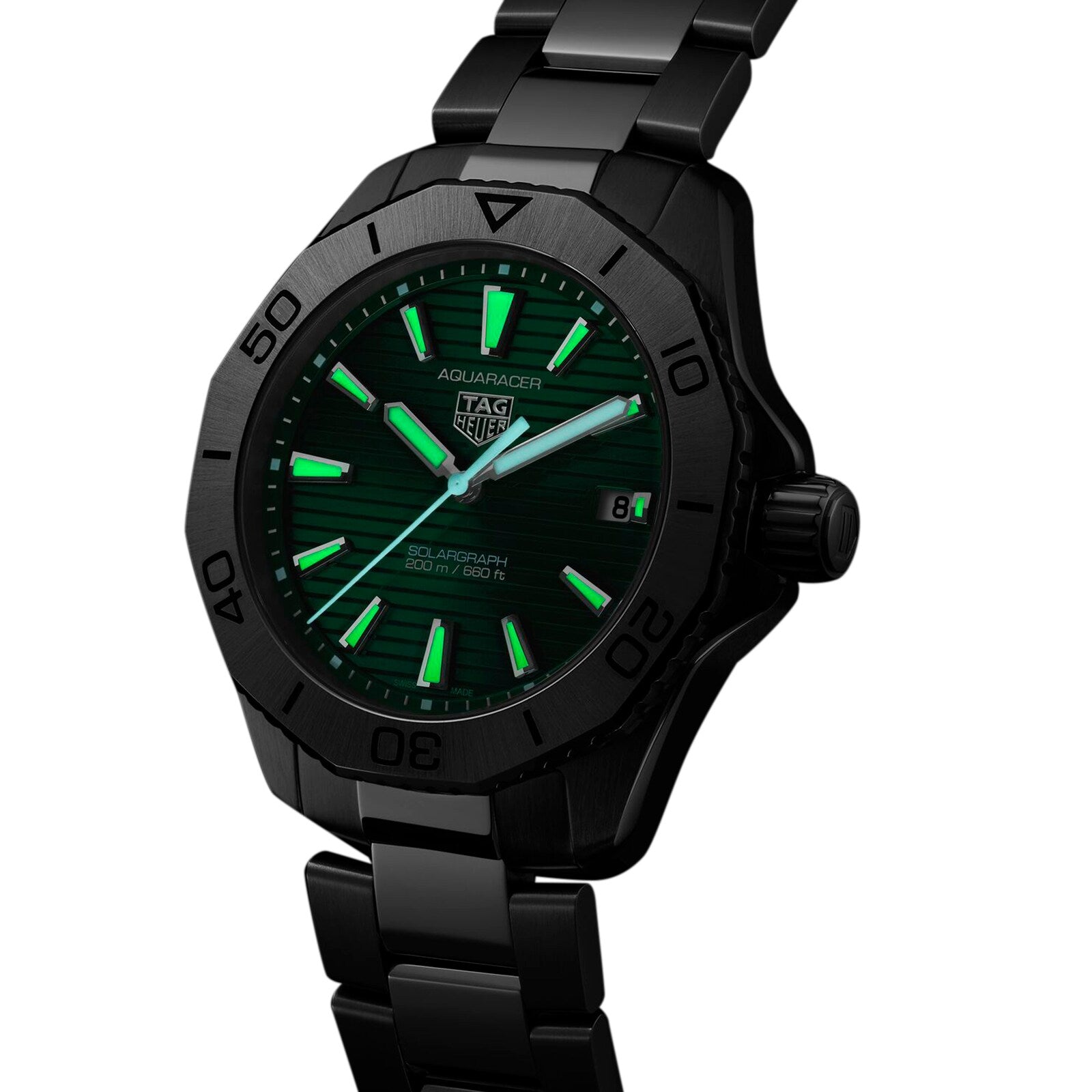 A black TAG Heuer Aquaracer Professional 200 Solargraph wristwatch with a green dial, luminous markers, unidirectional bezel, date display, and metal bracelet, showing the time as 8:19.