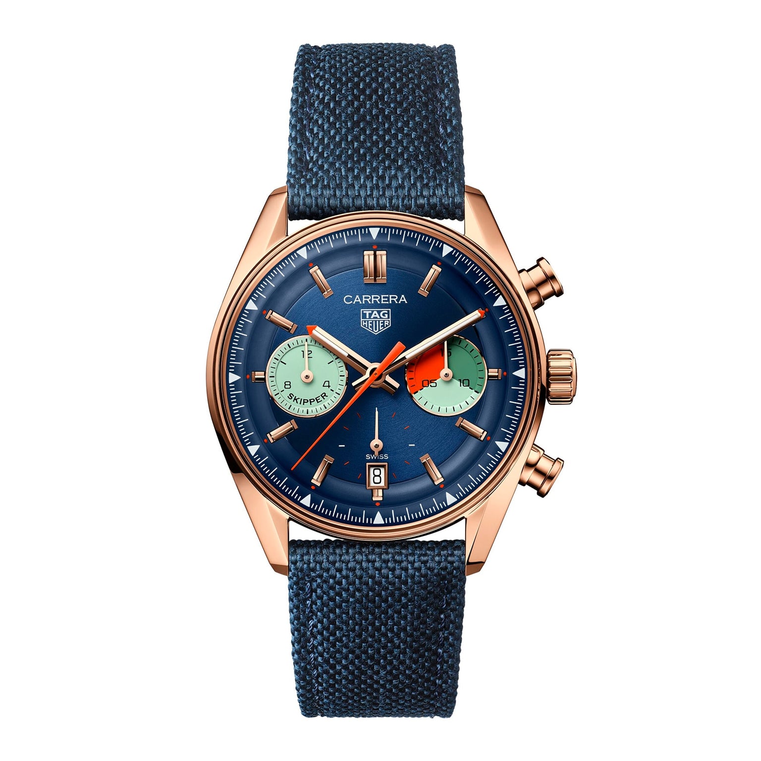 The TAG Heuer Carrera Chronograph Skipper features a gold case, blue textured strap, blue dial with two green subdials, orange chronograph hand, chronograph movement, and a date display at 6 o’clock.