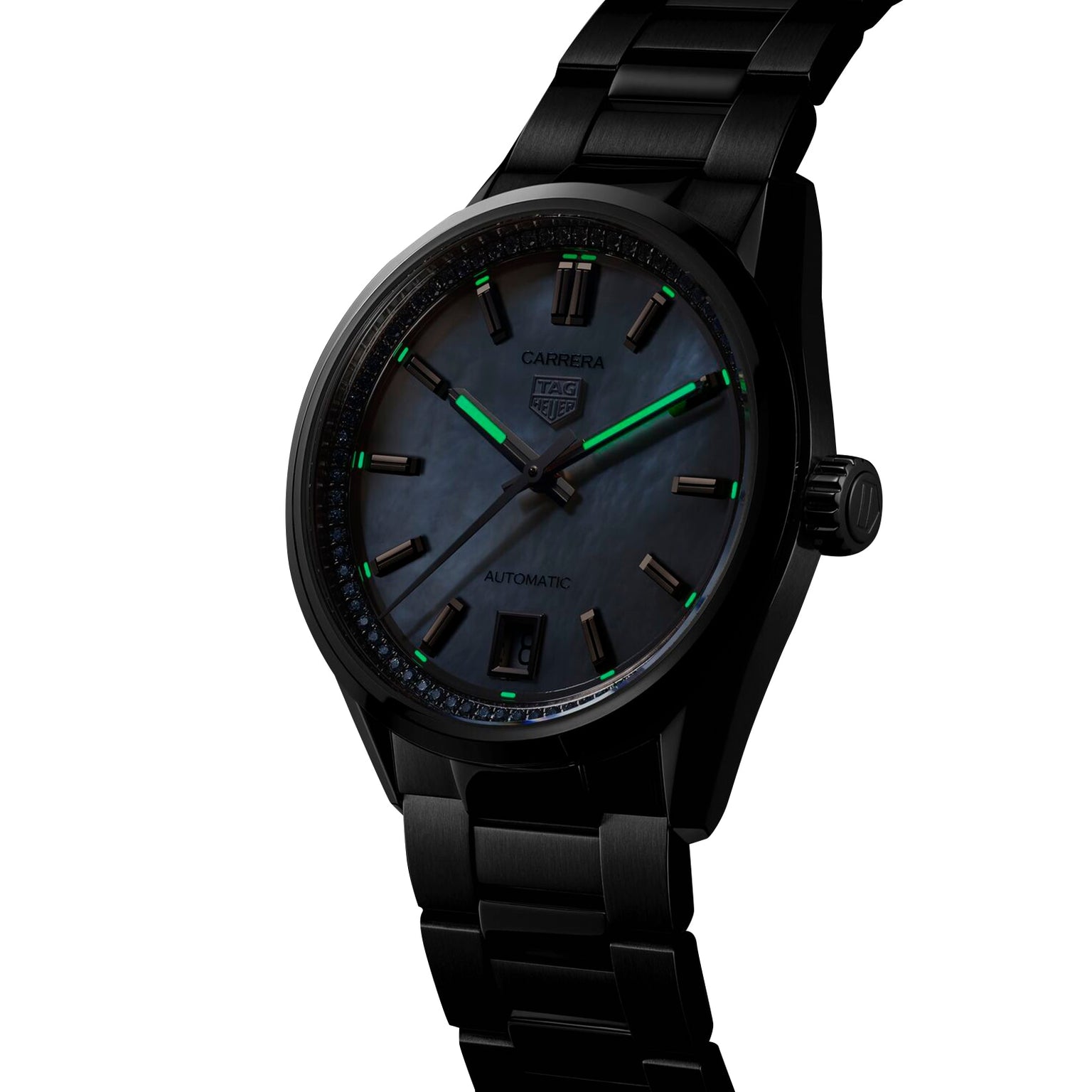 A black TAG Heuer Carrera Date wristwatch with automatic movement, dark iridescent dial, green luminescent markers, and metal bracelet is displayed angled on a white background.