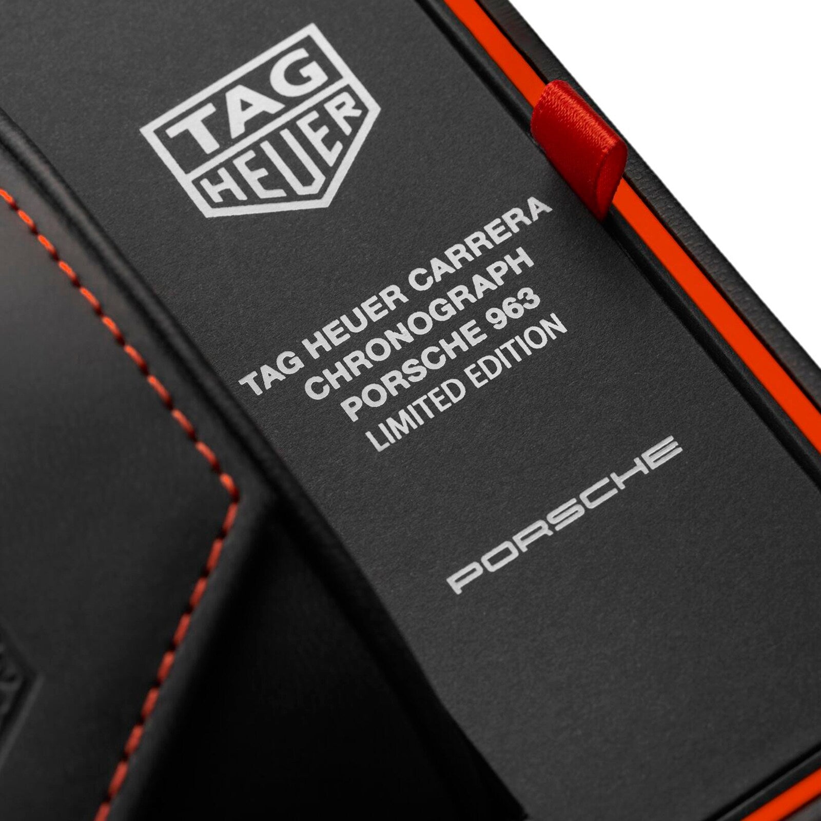 Black box with TAG Heuer and Porsche logos, labeled Limited Edition Carrera Chronograph x Porsche 963 by TAG Heuer, from the Carrera collection, featuring red and orange accents.