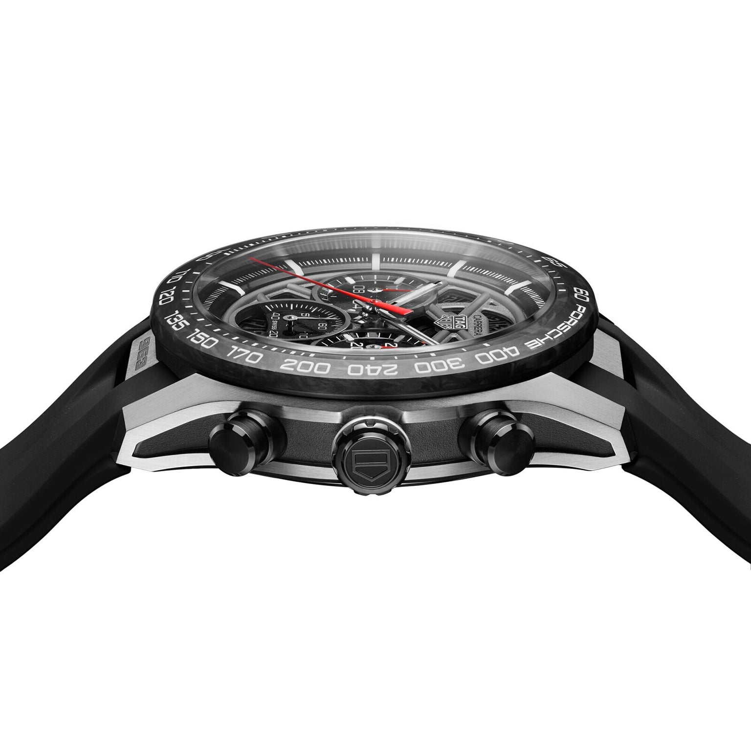 Side view of the TAG Heuer Limited Edition Carrera Chronograph x Porsche 963, showcasing a black and silver finish, textured bezel, two pushers, crown, and a detailed skeleton dial that reveals the intricate mechanics.