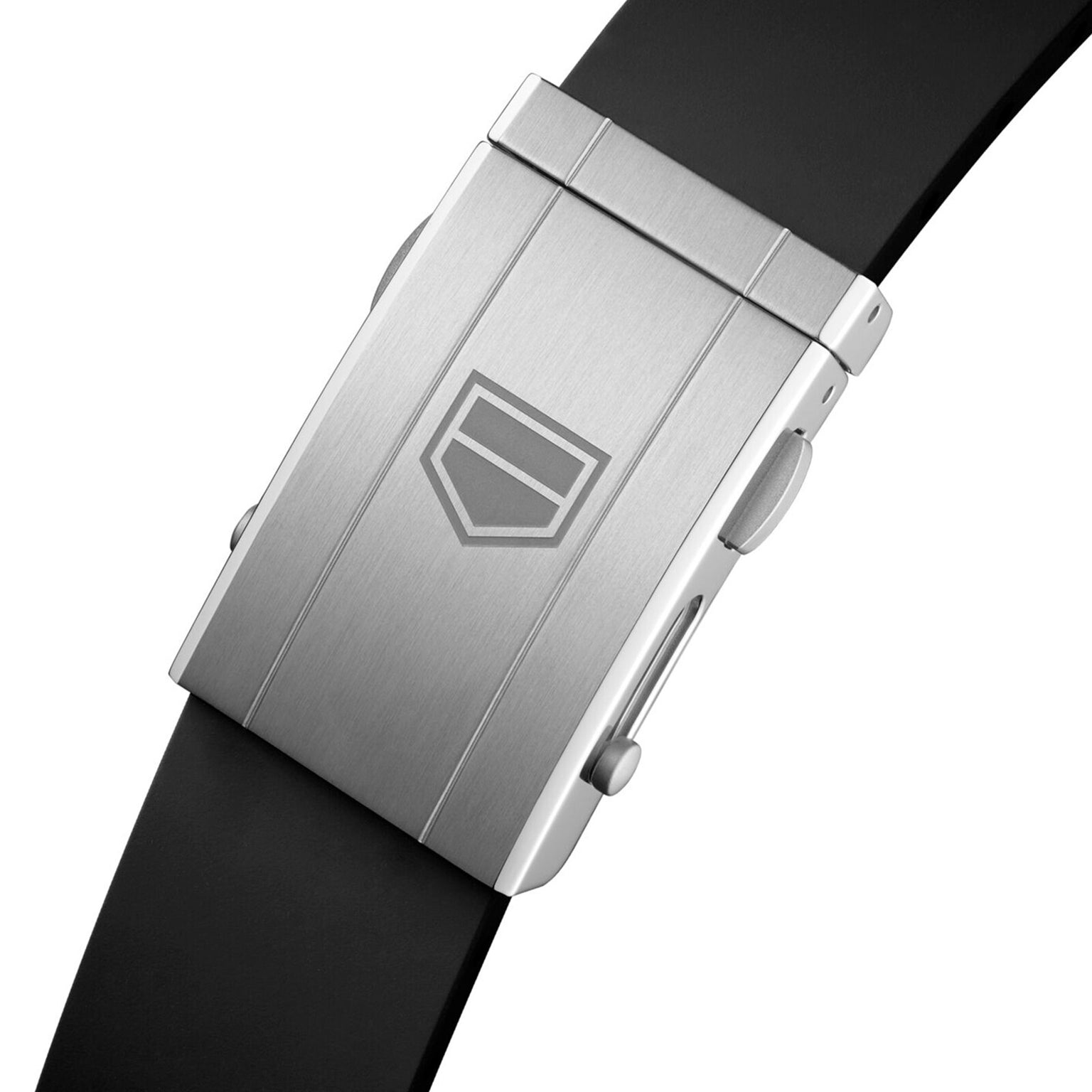Close-up of the TAG Heuer Limited Edition Carrera Chronograph x Porsche 963’s silver clasp with a geometric logo and black strap.