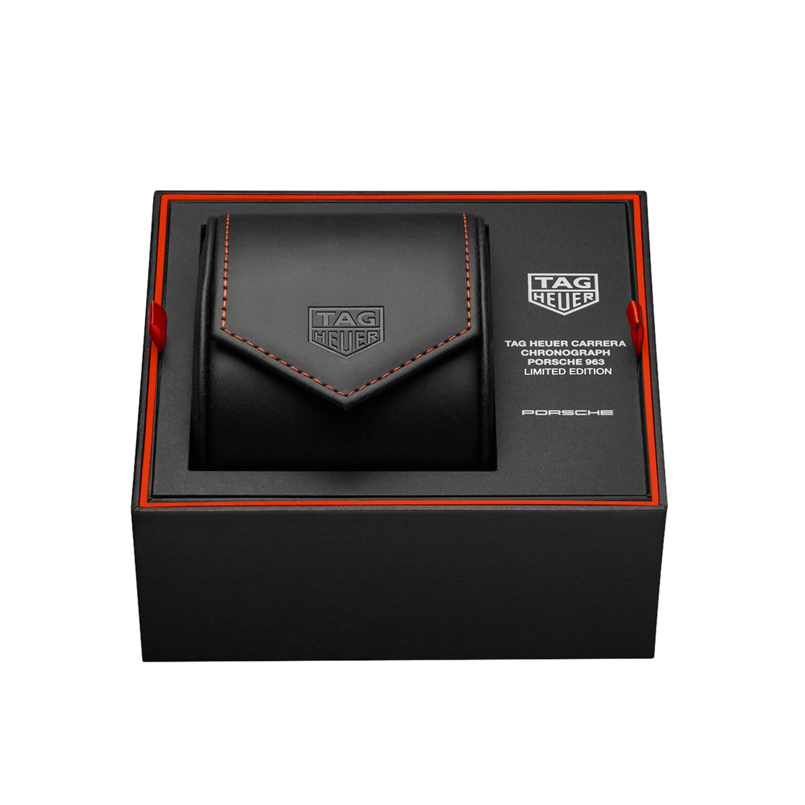 A black TAG Heuer box with orange accents showcases a black leather pouch and Carrera branding for the Limited Edition Carrera Chronograph x Porsche 963.