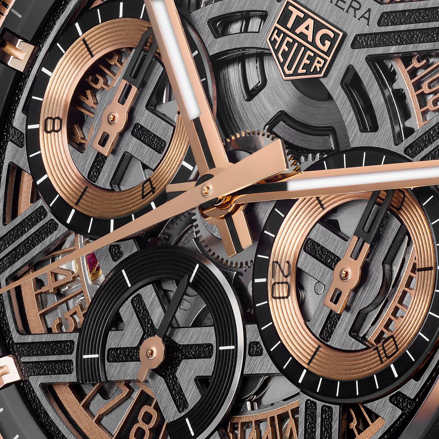 Close-up of the TAG Heuer Carrera Chronograph Extreme Sport watch face, showcasing intricate gears, motorsport-inspired dials, and rose gold hands alongside the visible TAG Heuer logo.