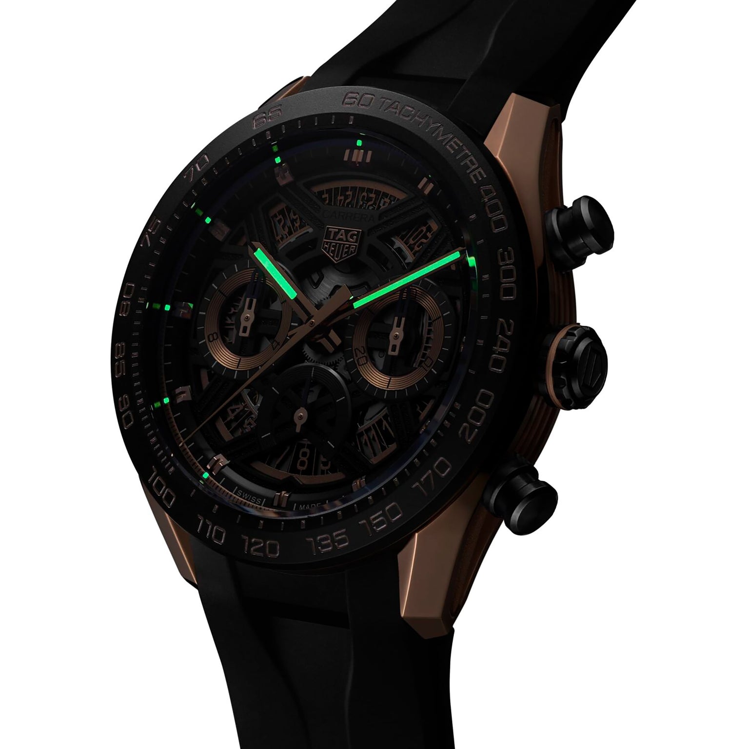 The TAG Heuer Carrera Chronograph Extreme Sport features a black and gold design, black strap, luminous green hands, and a tachymeter bezel—ideal for motorsport enthusiasts.