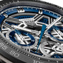 Close-up of a TAG Heuer Carrera Chronograph Extreme Sport watch face, showcasing blue, silver, and black details, visible gears driven by the TH20-00 movement, striking hands, and intricate subdials.