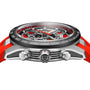 A close-up side view of the TAG Heuer Carrera Chronograph Extreme Sport watch with a silver case, black bezel, red accents, visible gears with TH20-00 movement, a red strap, and three crown buttons.